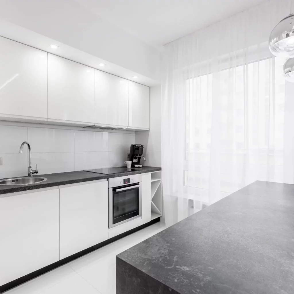 Granite Large Dark Granite Isaldn And Worktops in White Kitchen