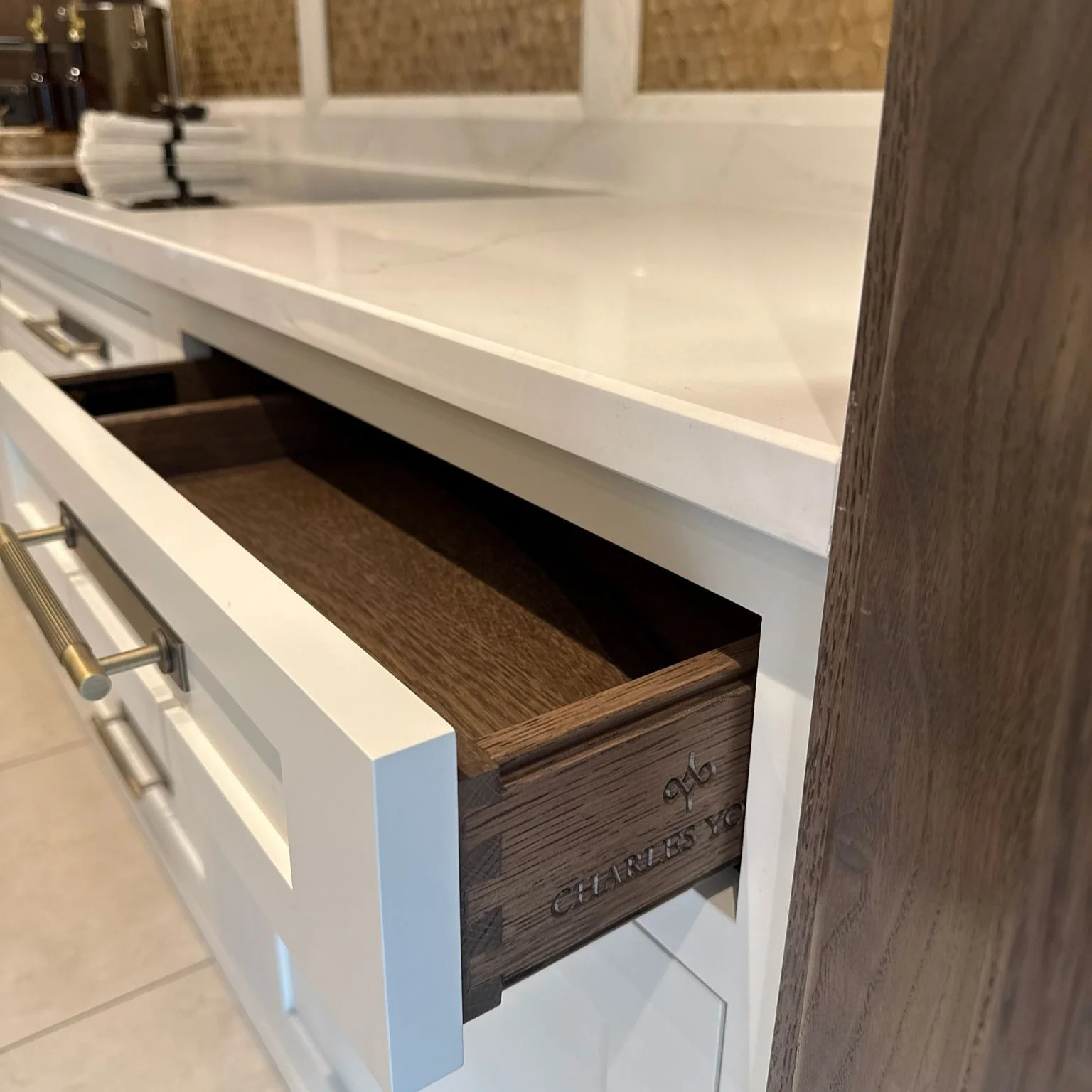 Fugen Tuscany Quartz Kitchen Worktop Contrast with Dark Wood Drawers - Yarm
